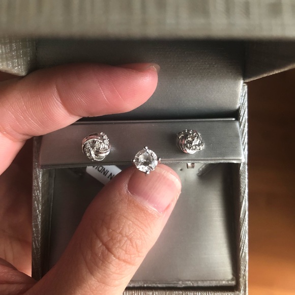 1/8 CT. T.W. Diamond Love Knot Stud Earrings in 20K White Gold - Picture 4 of 5